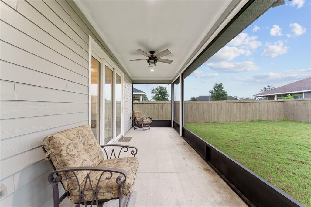 1788 Southwest 67th Circle Gainesville, FL 32607 - Photo 45 of 49 a view of a porch with furniture and a yard