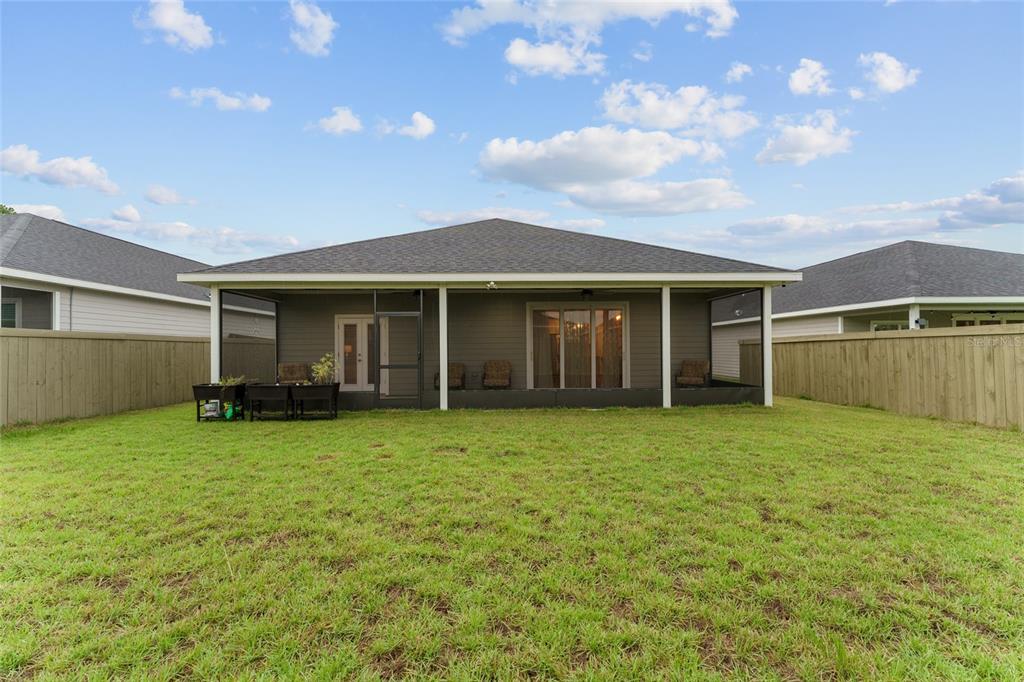 1788 Southwest 67th Circle Gainesville, FL 32607 - Photo 47 of 49 a view of a house with a garden