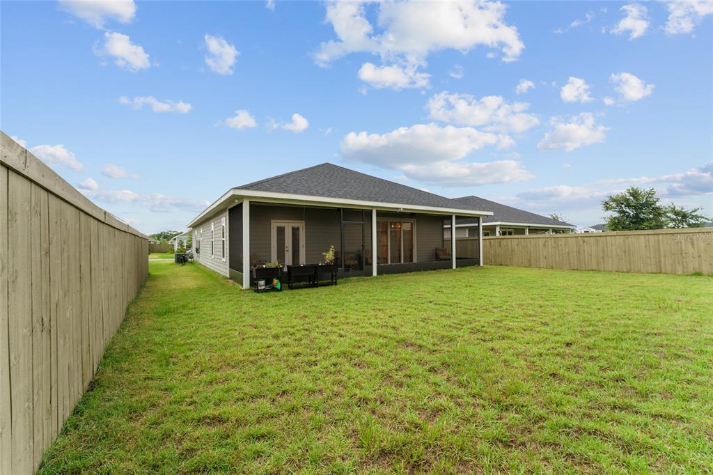 1788 Southwest 67th Circle Gainesville, FL 32607 - Photo 48 of 49 a view of a house with backyard and garden
