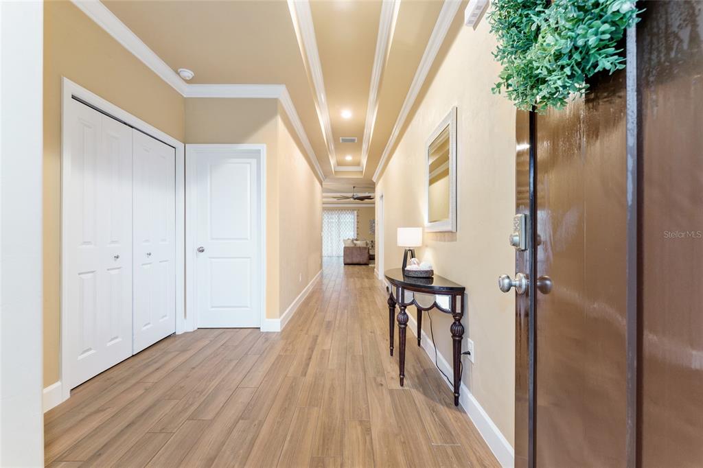 1788 Southwest 67th Circle Gainesville, FL 32607 - Photo 5 of 49 a view of a hallway with wooden floor and staircase