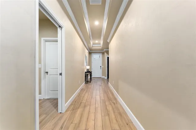 a living room with furniture a flat screen tv and a table
