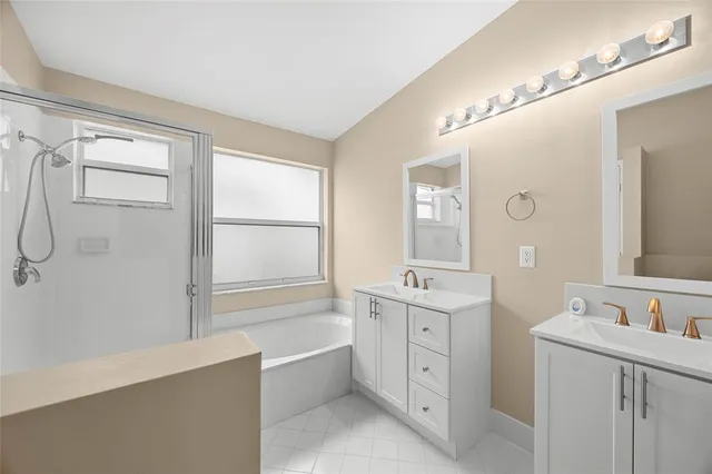 a view of a chair and table in backyard of the house