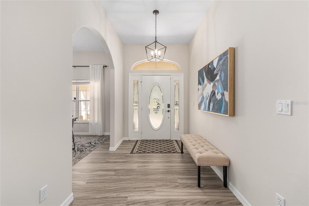 5248 Northwest 82nd Court Ocala, FL 34482 - Photo 11 of 73 a view of a hallway with wooden floor and a window