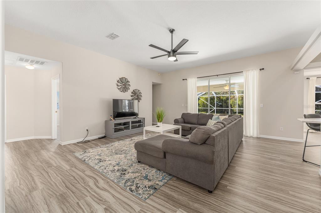 5248 Northwest 82nd Court Ocala, FL 34482 - Photo 12 of 73 a living room with furniture and a wooden floor