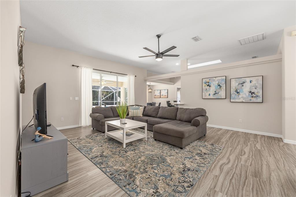 5248 Northwest 82nd Court Ocala, FL 34482 - Photo 13 of 73 a living room with furniture and a flat screen tv
