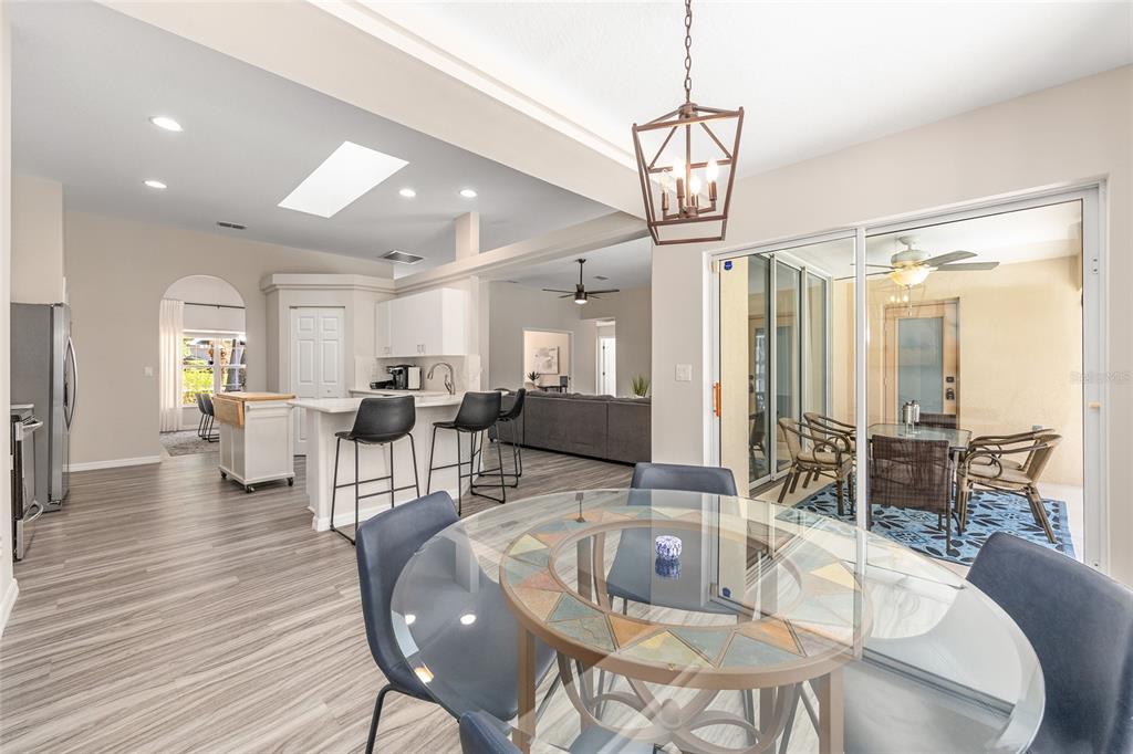 5248 Northwest 82nd Court Ocala, FL 34482 - Photo 23 of 73 a living room with lots of furniture and a chandelier