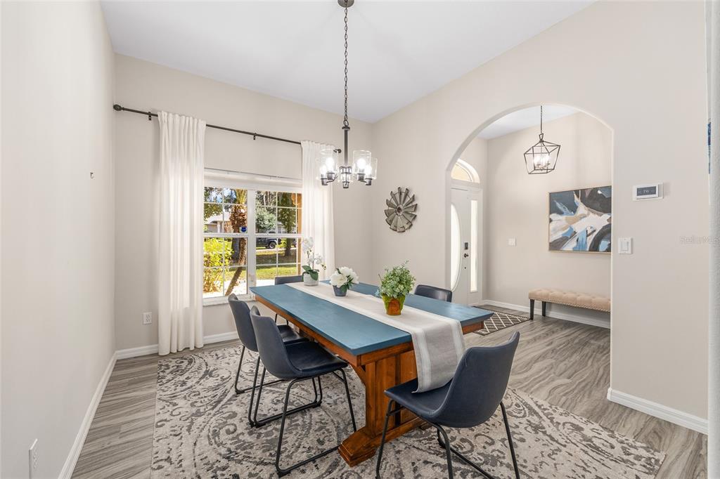 5248 Northwest 82nd Court Ocala, FL 34482 - Photo 24 of 73 a view of a dining room with furniture window and wooden floor