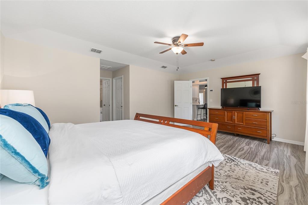 5248 Northwest 82nd Court Ocala, FL 34482 - Photo 30 of 73 a bedroom with a bed and a flat screen tv