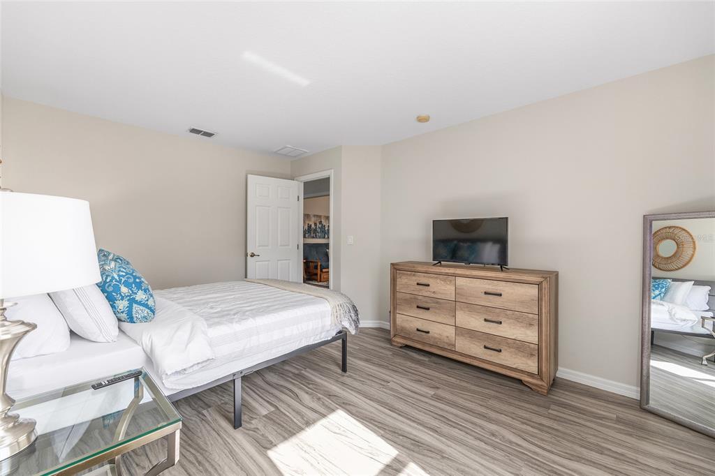 5248 Northwest 82nd Court Ocala, FL 34482 - Photo 37 of 73 a bedroom with a bed and a flat screen tv