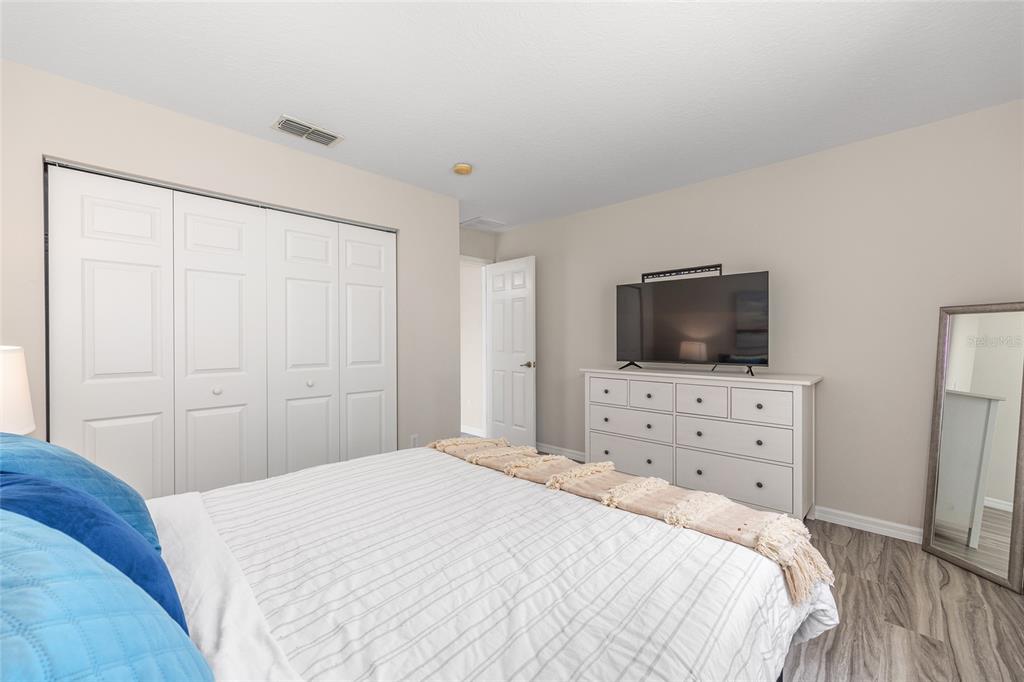 5248 Northwest 82nd Court Ocala, FL 34482 - Photo 40 of 73 a bedroom with a bed and a flat screen tv