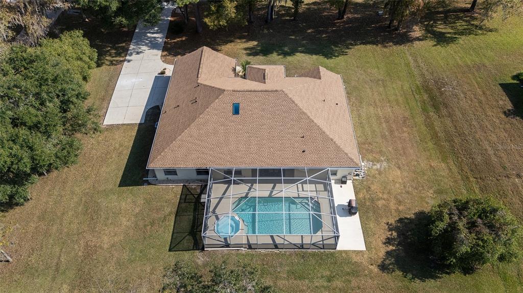 5248 Northwest 82nd Court Ocala, FL 34482 - Photo 4 of 73 an aerial view of a house with pool garden and lake view