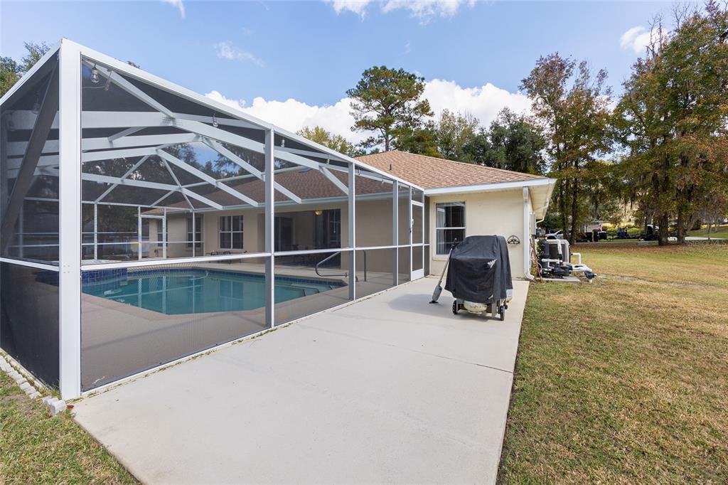 5248 Northwest 82nd Court Ocala, FL 34482 - Photo 55 of 73 a view of a patio with wooden floor and roof