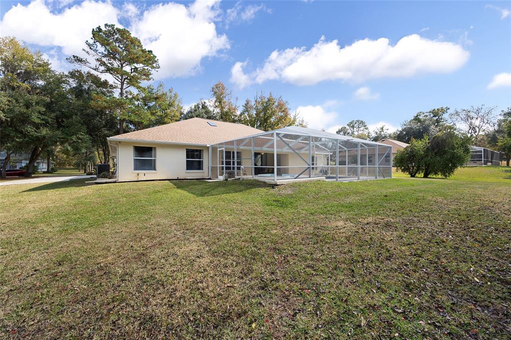 5248 Northwest 82nd Court Ocala, FL 34482 - Photo 58 of 73 a view of a house with a yard and sitting area