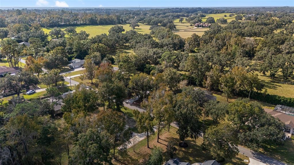 5248 Northwest 82nd Court Ocala, FL 34482 - Photo 64 of 73 an aerial view of residential houses with outdoor space and trees