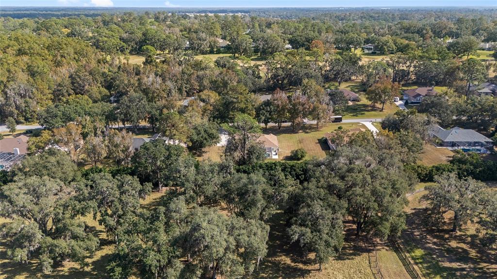 5248 Northwest 82nd Court Ocala, FL 34482 - Photo 70 of 73 an aerial view of residential houses with outdoor space and trees
