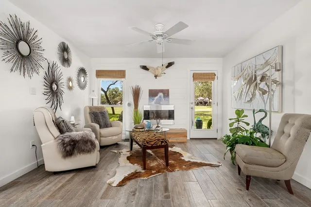 a living room with furniture and a large window