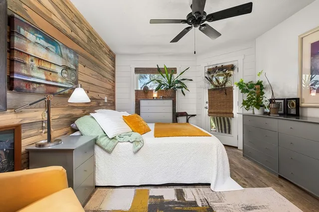 a view of a dining room with furniture and a chandelier