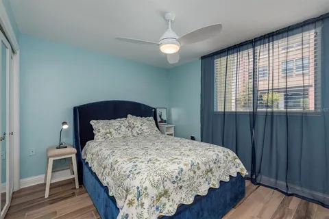 a bedroom with a bed and a cabinets