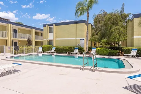 a view of a chair and table in backyard
