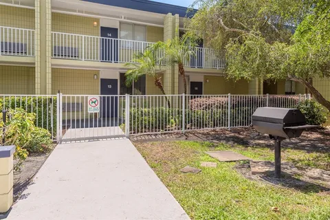 a sign that is sitting on a brick wall