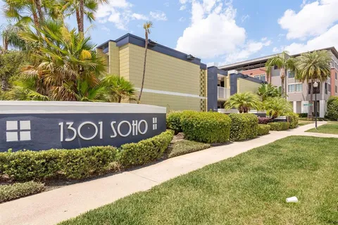 a view of a chair and table on the garden