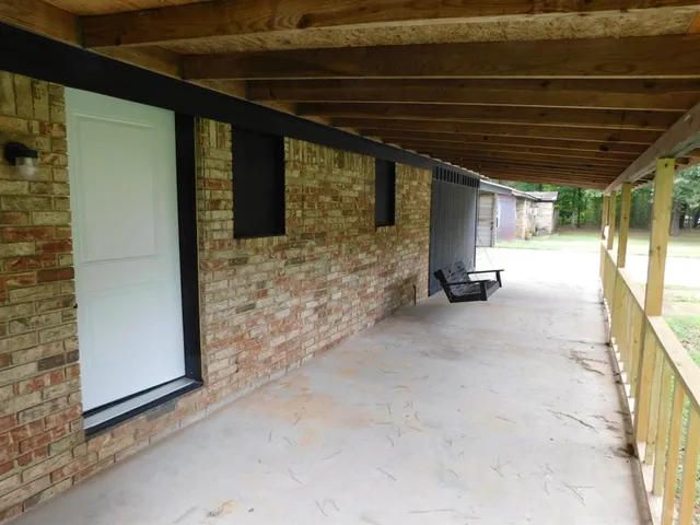 a kitchen with granite countertop cabinets stainless steel appliances and a sink