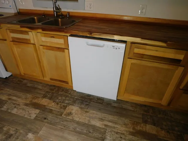a hallway with a wooden floor and window