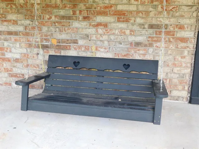 a brick house with a small yard