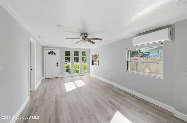 a view of an empty room with a window