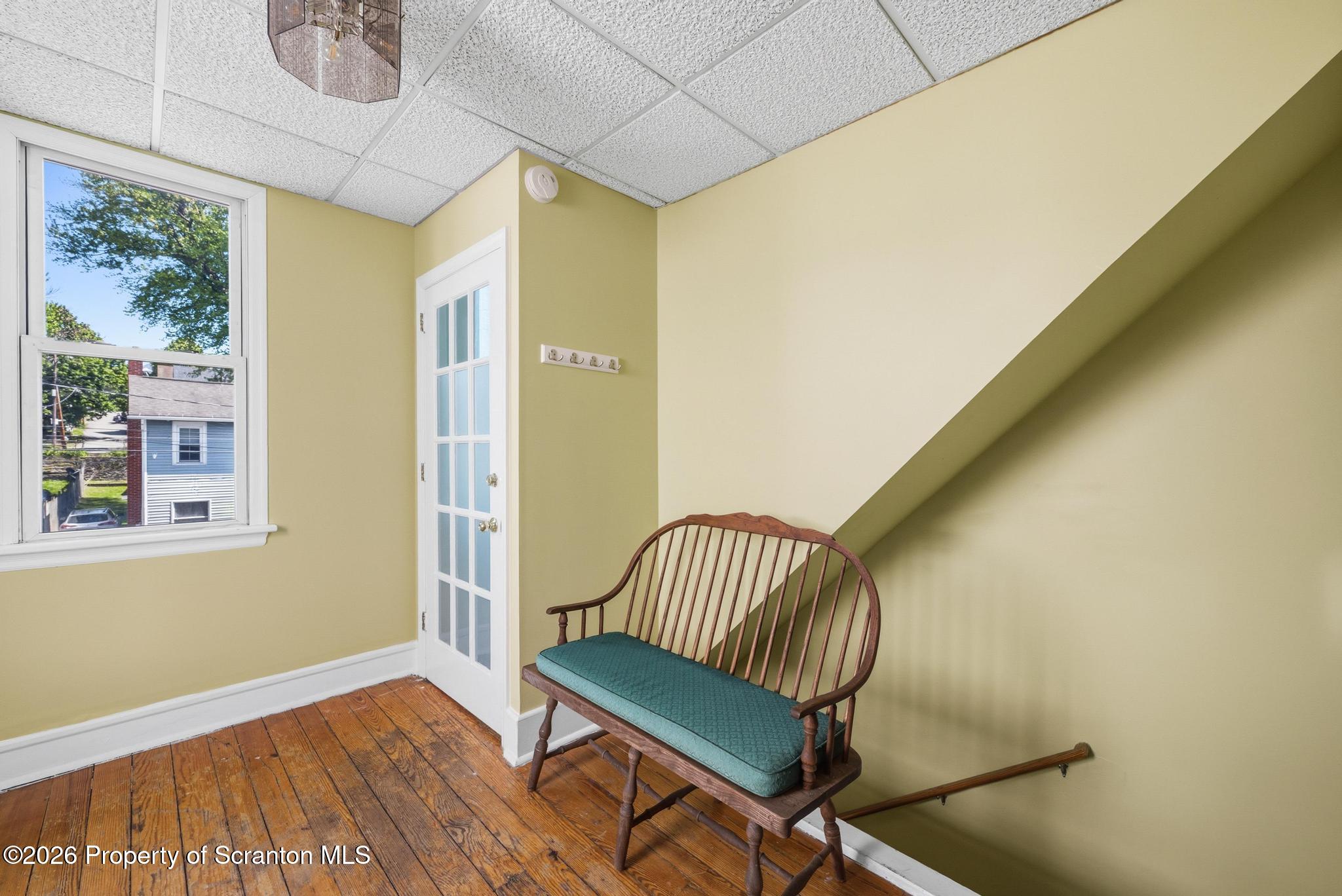 518 Prospect Avenue Scranton, PA 18505 - Photo 55 of 59 a view of a hallway with wooden floor and a window