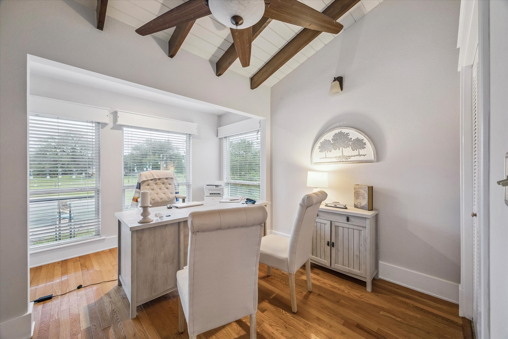 3515 County Road 36 Angleton, TX 77515 - Photo 26 of 50 a room with stainless steel appliances a dining table wooden floor and a large window