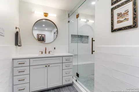a bathroom with a bathtub and a shower