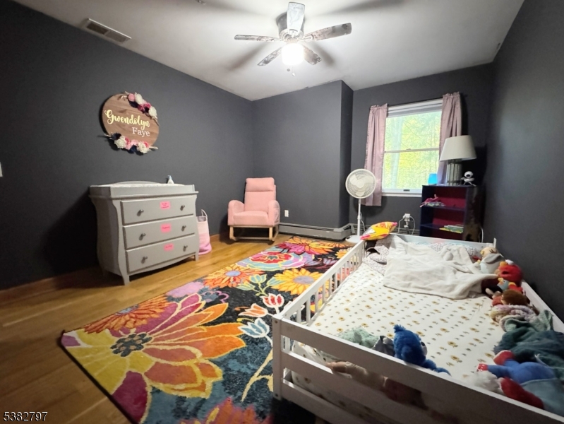 11 Hirams Grove Road Branchville, NJ 07826 - Photo 20 of 50 a bed sitting in a bedroom next to a window
