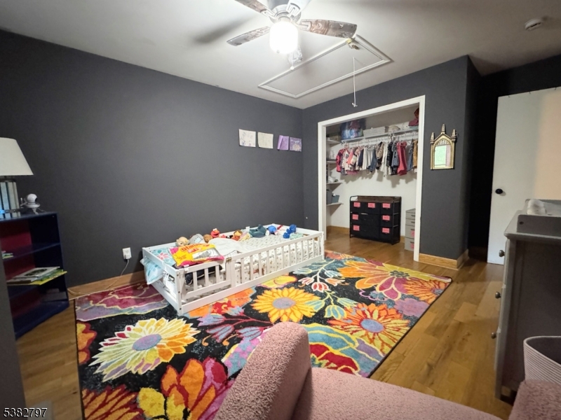 11 Hirams Grove Road Branchville, NJ 07826 - Photo 21 of 50 a bed room with furniture and a flat screen tv