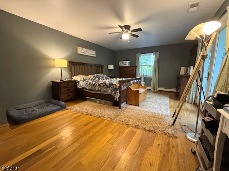 11 Hirams Grove Road Branchville, NJ 07826 - Photo 22 of 50 a bed room with a bed furniture and a chandelier