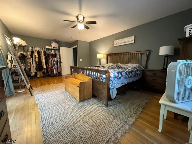 a bed room with a bed and a chair