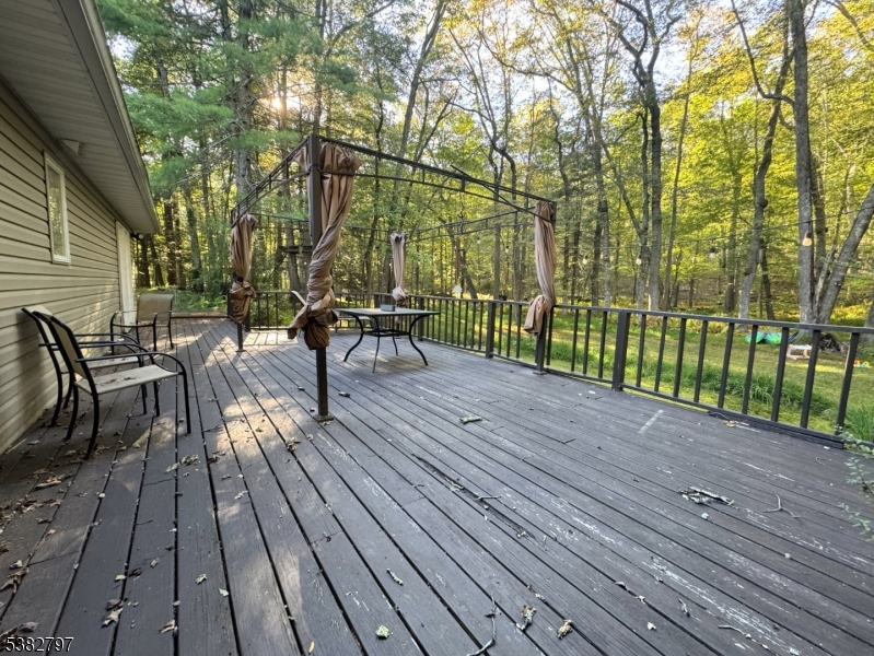 11 Hirams Grove Road Branchville, NJ 07826 - Photo 34 of 50 a view of a wooden deck with chairs