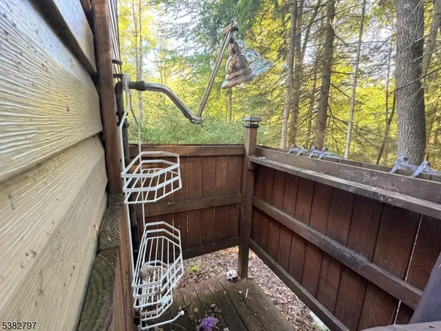 a view of a backyard with a garden and fire pit