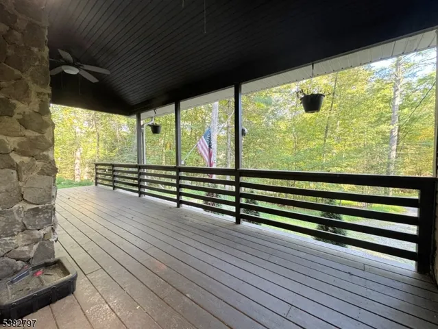 a view of outdoor space with wooden floor