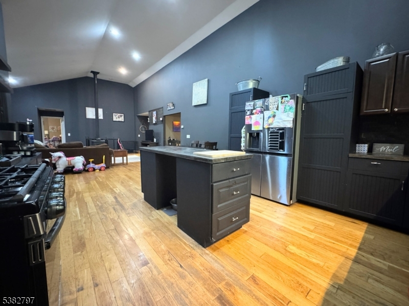 11 Hirams Grove Road Branchville, NJ 07826 - Photo 9 of 50 a kitchen with stainless steel appliances granite countertop a refrigerator a stove and a wooden floors