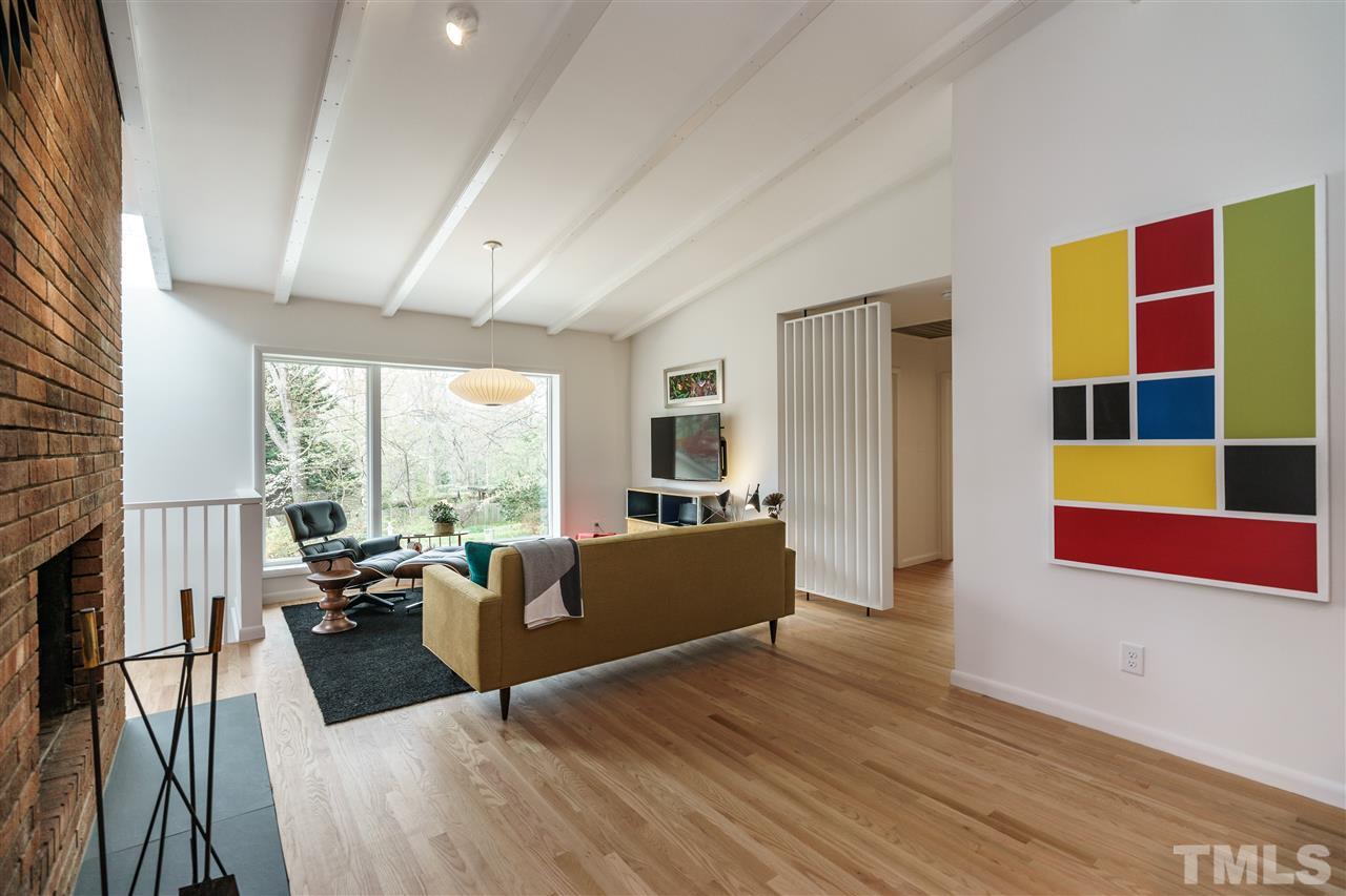 3322 Ocotea Street Raleigh, NC 27607 - Photo 11 of 25 a living room with furniture and a large window