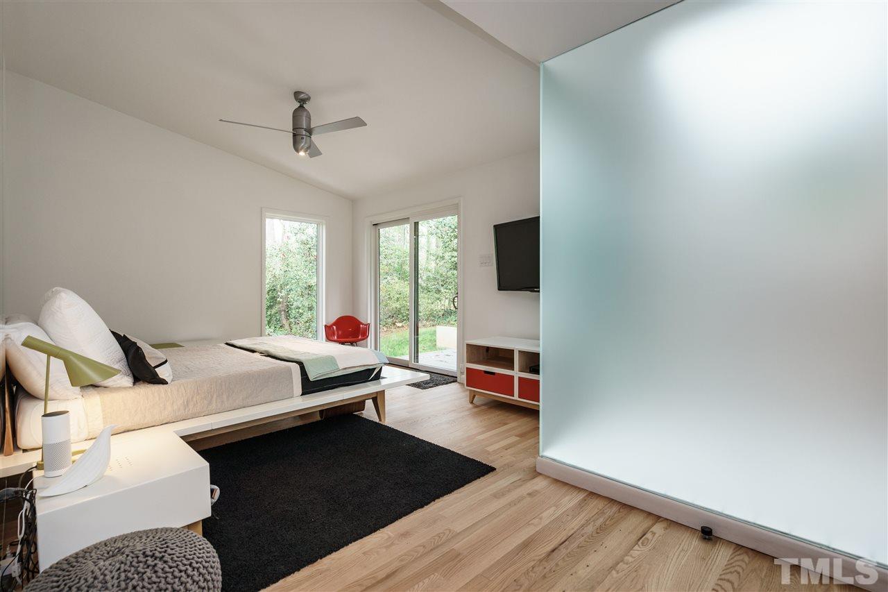 3322 Ocotea Street Raleigh, NC 27607 - Photo 13 of 25 a bedroom with furniture and a window