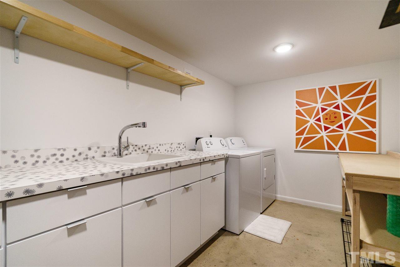 3322 Ocotea Street Raleigh, NC 27607 - Photo 21 of 25 a utility room with sink dryer and washer