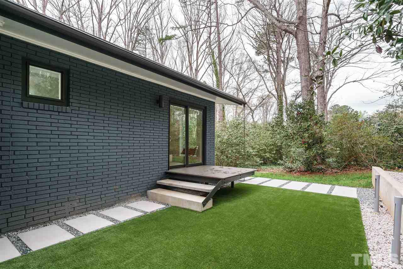 3322 Ocotea Street Raleigh, NC 27607 - Photo 22 of 25 a view of backyard with a garden
