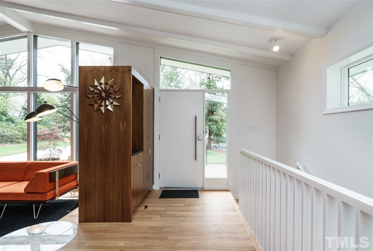 3322 Ocotea Street Raleigh, NC 27607 - Photo 24 of 25 a view of a balcony with chair and wooden floor