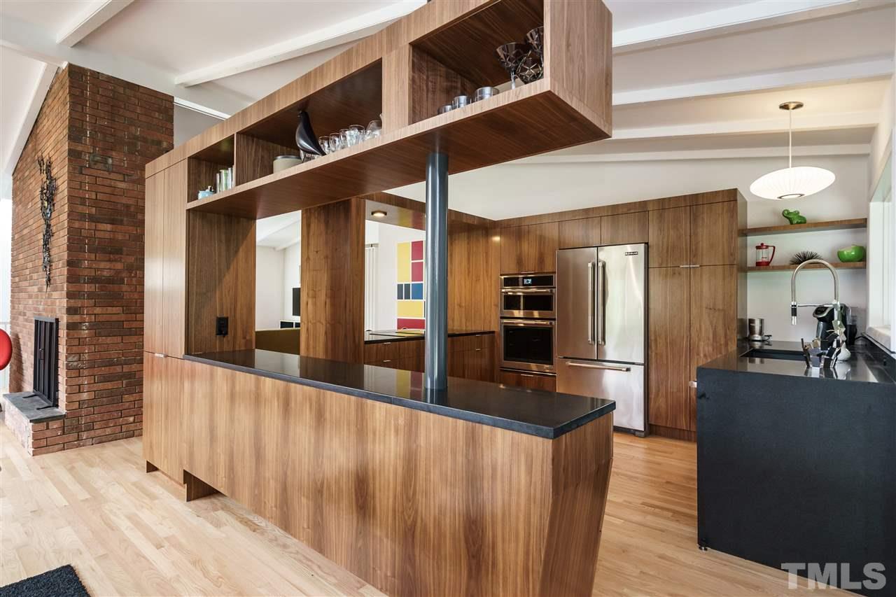 3322 Ocotea Street Raleigh, NC 27607 - Photo 7 of 25 a view of a living room with a large window