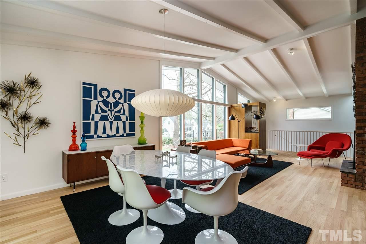 3322 Ocotea Street Raleigh, NC 27607 - Photo 8 of 25 a view of a dining room with furniture and wooden floor