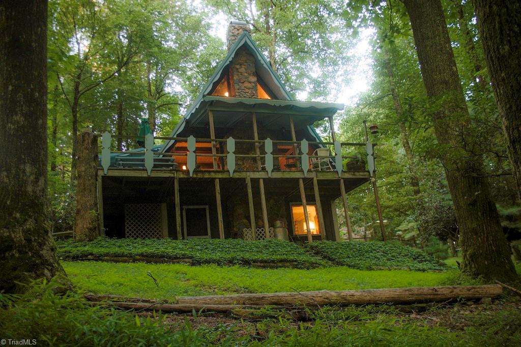 47 Ridge Road Glade Valley, NC 28627 - Photo 1 of 25 This 3 Level A Frame sits amidst a lush mountain landscape. Watch the deer from the deck as you relax after a day on the golf course. There is plenty of room for entertaining both indoors and out.