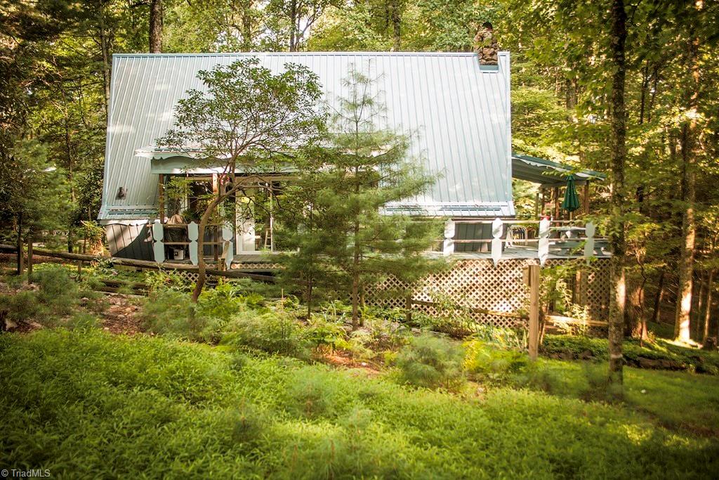 47 Ridge Road Glade Valley, NC 28627 - Photo 19 of 25 A side view of the home which displays the recently installed metal roof.