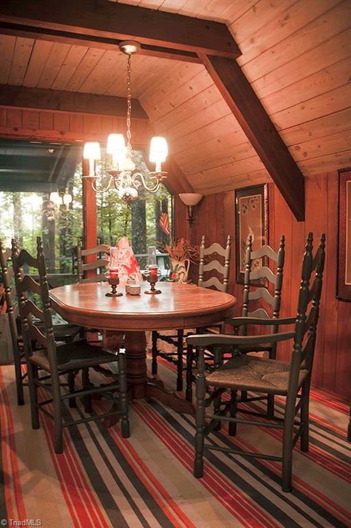 47 Ridge Road Glade Valley, NC 28627 - Photo 20 of 25 The dining area has a pretty blue and white chandelier, and has space for a full sized dining table and chairs.